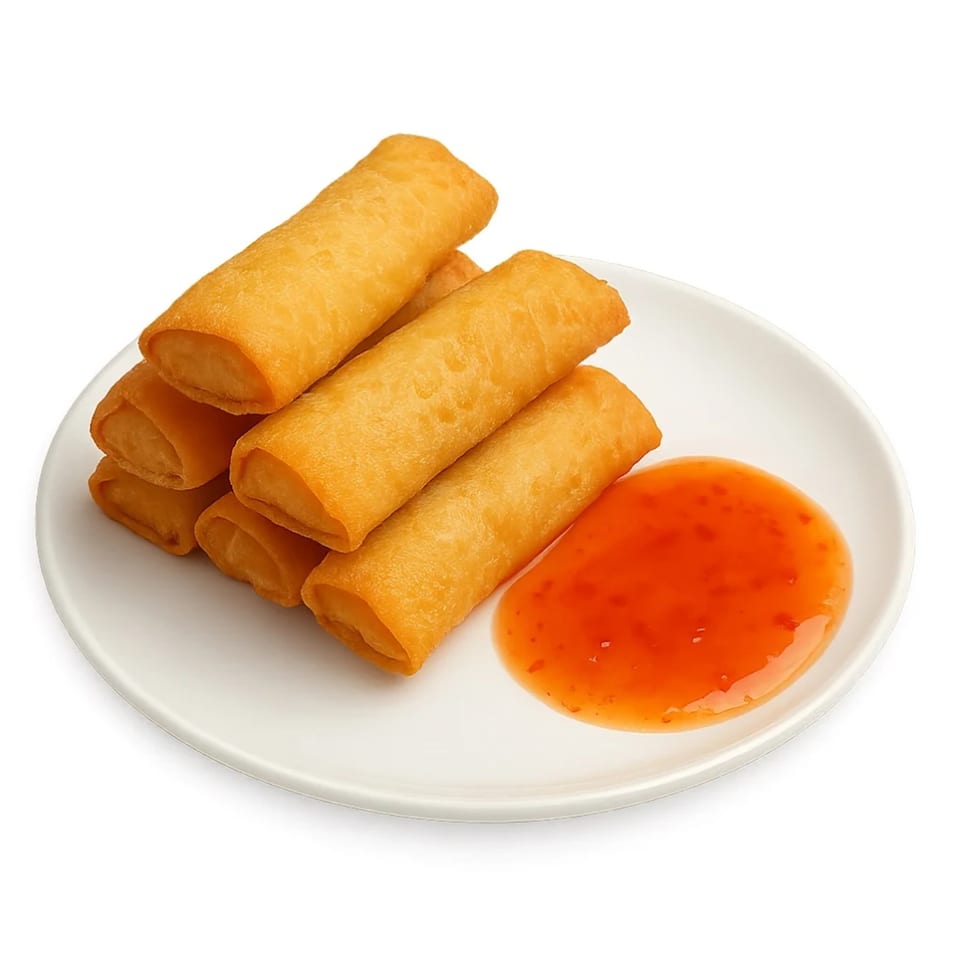 Golden-fried Thai spring rolls with sweet chili dipping sauce on a white plate.